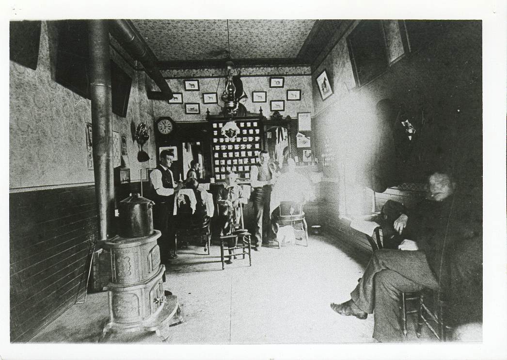 135E1 This picture is from 1890 showing the Vern Kinsey Barber Shop located where I.T. Solutions is today.
